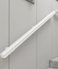Rugged White Solid Wood Guardrail Loaded With Beefy Steel Brackets For Indoor Attic Or Stairway Safety Barrier on wall.