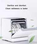 Hassle Free 22 Inch Countertop Dishwasher With No Hookup Setup And Built In Tank For Effortless Home Cleaning Featuring Five Rapid Wash Cycles Tough Stainless Steel Interior And Six Place Setting Rack open door showing clean dishes inside.