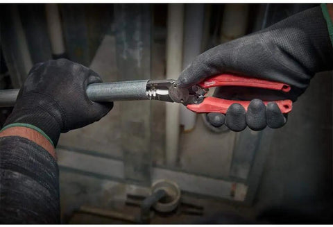 Gloved hands using Six-In-One Long Nose Pliers For Electricians Pro Grade Wire Stripper And Reamer Combo Seven And One Half Inch Forged Alloy Steel