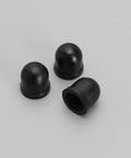 Three black pivot cups from 10 Piece Skateboard Truck Pivot Cup Repair Kit For Three And A Quarter Inch Long Plate Trucks Black Pro Grade PU Liner Replacement Durable Shock Absorbent Easy Install For Smooth Rides And Quick Fixes.