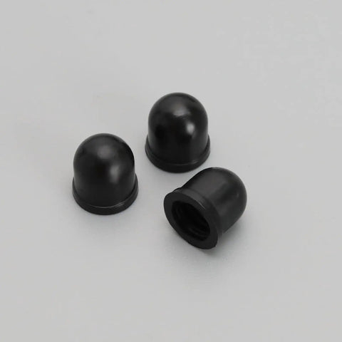 Three black pivot cups from 10 Piece Skateboard Truck Pivot Cup Repair Kit For Three And A Quarter Inch Long Plate Trucks Black Pro Grade PU Liner Replacement Durable Shock Absorbent Easy Install For Smooth Rides And Quick Fixes.