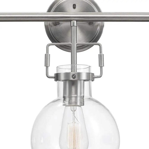 Close-up of brushed nickel light fixture with clear glass bulb, part of the All In One Bathroom Vanity Set With A 3 Light Fixture.