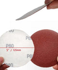 Premium Flocking Sandpaper Discs 5 Inches Hook Loop PSA For Polishing Grits 40 To 2000 With Durable Alumina Coating and Quick Swap Flannelette Backing displayed for easy use.