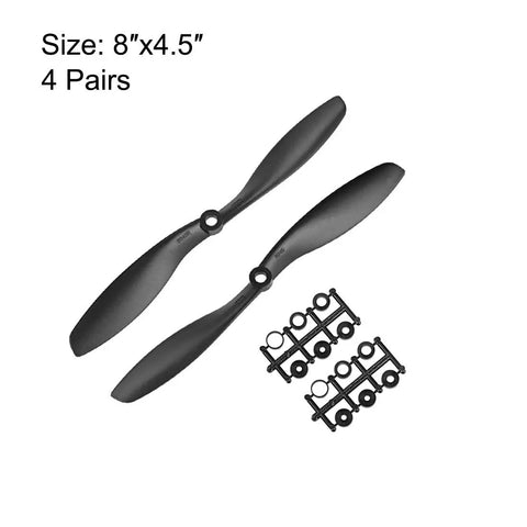Rugged RC Propellers 8x4.5 Inch Nylon Two Vane CW CCW Set For Fixed Wing Aircraft With Adapter Rings Black Finish, shown with adapters.