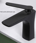 Black dual-use faucet for bathroom, modern design, suitable for hot and cold water, enhancing any lavatory setup.