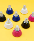 Assorted colors of 2 Pack Roller Skate Toe Stops With 82A PU Rubber Plugs And Brake Blocks For All Surfaces on yellow background