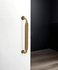 10 Pack 5 Inch Cabinet Pulls Antique Brass Zinc Alloy Drawer Pulls installed on white door in modern setting