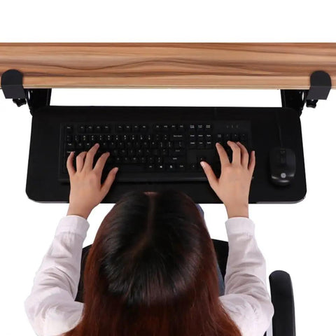 Rock Solid Retractable Keyboard Tray With Slick Pull Out Action For Effortless Typing And Plenty Of Mouse Space Totally Clutter Free Under Desk Office Essential Black, top view with hands on keyboard.
