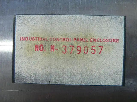 Label on used industrial control panel enclosure N 379057 ready to roll, showing serial number and enclosure specifications.