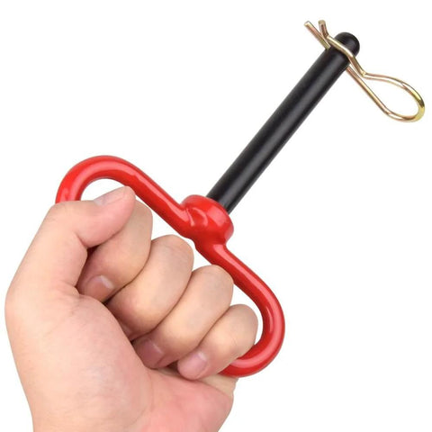 Two Pack Three Quarter Inch By Four And A Half Inch Steel Hitch Pins With Red Rubber Coated Handles And Clips For Tow Hitch Receiver Heavy Duty Clevis Pins Red Color Trailer Pins shown in hand