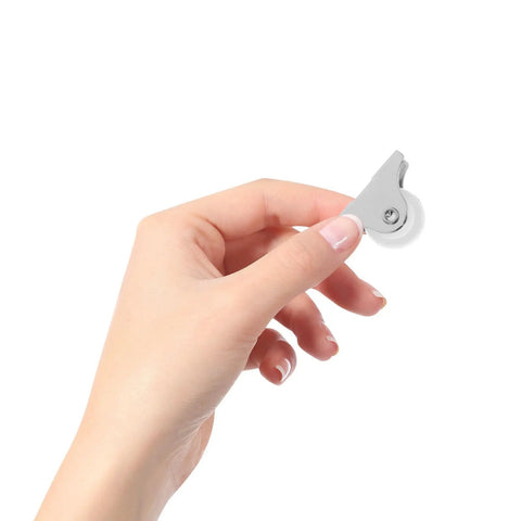 Directional Caster Wheel 12pcs Inch White PP for Furniture DIY, held in hand showing flexible design and white plastic wheel.