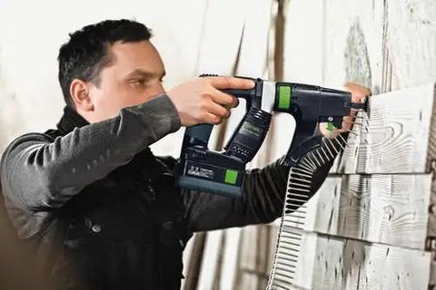 Person using Hardcore No Fuss Cordless Construction Screwdriver With Brushless Motor Tech for fastening wood planks.