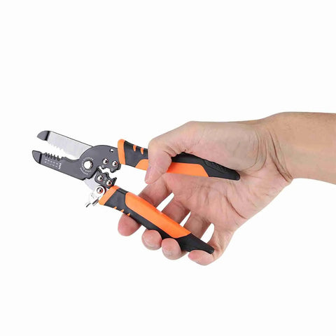 Hand holding versatile wire stripper pliers cutting tool for DIY wiring auto and home projects electrician grade heavy duty manganese alloy built