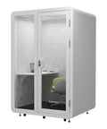 Portable Soundproof Phone Booth With Smooth Rolling Wheels Hella Quiet Office Pod Rig For Remote Hustle And Broadcast Streaming Includes Chill Cooling Fan Bright Lamp And Reliable Power Outlet with transparent doors and interior desk.