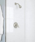 Builders 1-Handle 1-Spray Pressure Balance Shower Faucet In Brushed Nickel with white tiled shower wall