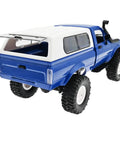 Rear view of RC Rock Crawler WPL C24 RTR 1/16 Scale Pickup Truck with LED Lights, high traction tires, and spare tire.