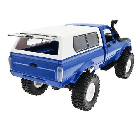 Rear view of RC Rock Crawler WPL C24 RTR 1/16 Scale Pickup Truck with LED Lights, high traction tires, and spare tire.