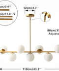Groovy Mid Century Modern Pendant Light Set Featuring Sleek Glass Globes and Gold Finish, seven bulb adjustable height.