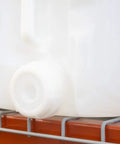 5 gallon container of All Purpose Go To Food Grade Mineral Oil For Cutting Boards And Butcher Blocks on shelf, close-up view