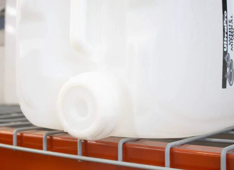 5 gallon container of All Purpose Go To Food Grade Mineral Oil For Cutting Boards And Butcher Blocks on shelf, close-up view