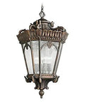 Victorian 4 Light Outdoor Pendant Light In Textured Black Finish With Clear Seeded Glass Panels hanging from a chain, showcasing ornate detailing.
