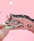 Close-up of compact single hole punch metal circle punch for scrapbooking and office use, 6mm hole puncher with waste holder.