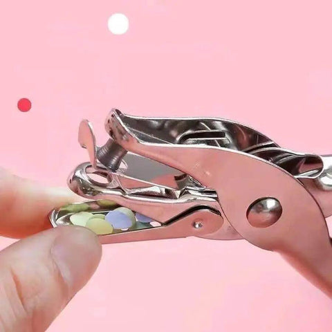 Close-up of compact single hole punch metal circle punch for scrapbooking and office use, 6mm hole puncher with waste holder.