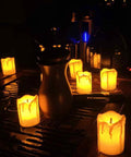 Led Tea Lights Candles Battery Operated Flameless Votive Candles Drips Realistic Fake Candles For Halloween Thanksgiving Christmas Decor Totally Safe For Pets And Kids Easy To Use 1.5x2 Inches 12 Pack shown glowing on a table