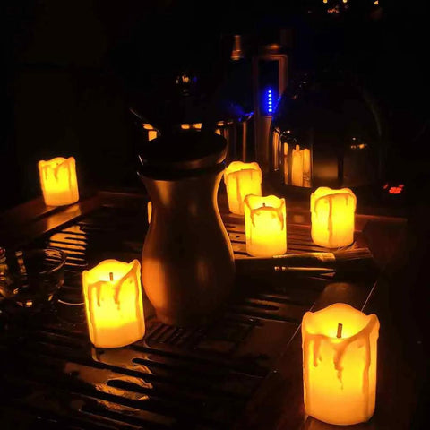 Led Tea Lights Candles Battery Operated Flameless Votive Candles Drips Realistic Fake Candles For Halloween Thanksgiving Christmas Decor Totally Safe For Pets And Kids Easy To Use 1.5x2 Inches 12 Pack shown glowing on a table