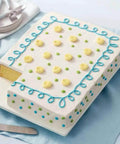 Decorated sheet cake on a platter made in an Extra Large 11 X 15 Inch Aluminum Baking Sheet Pan With 2 Inch Deep Sides For Even Heating