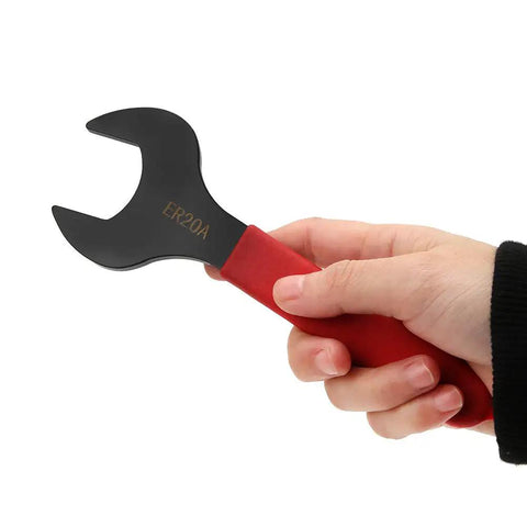 Person holding Castle Nut Wrench For ER20A Clamping Collet Chuck Spanner with red handle, heavy-duty cast steel.