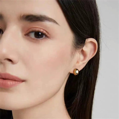 Chunky Half Ball Stud Earrings For Women With Gold Tone Finish Hypoallergenic Minimalist Oval Cartilage Studs Brass Base With 925 Sterling Silver Post Nickel Free And Lead Free Gift Velvet Pouch on model ear