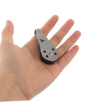 Single stainless steel pulley block held in hand, part of 4pc set for kayak and boat anchor, heavy duty marine grade use