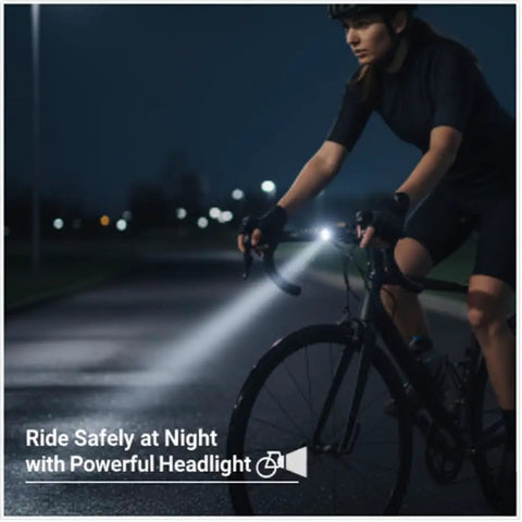 Cyclist using 4K Bike Camera With GPS Tracking And Integrated Cycling Computer Headlight at night with powerful headlight.