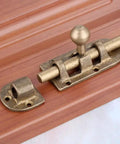Heavy Duty Bronze Brass Door Slide Bolt With Vintage Barrel Catch Latch For Secure Cabinet Drawer Window Closure Tough Heavy Metal That Stays Put And Installs Without A Hitch At 105 X 33mm on wooden background