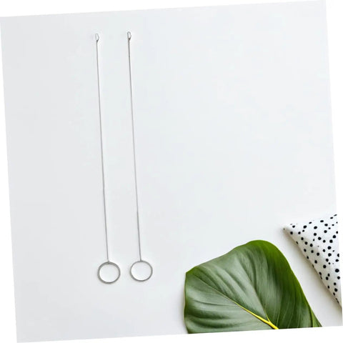 Two pieces from the Five Piece Long Sewing Needle Threader Kit With Stainless Steel Hook Latch Easy Threading on a white surface.