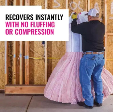 Man installing Unfaced R21 Fiberglass Insulation Batts Configured For 2X6 Walls in wall cavity, showing easy placement and coverage.