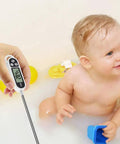 Digital Meat Thermometer For Cookin And BBQ With Long Probe, Instant Read, showing temperature as baby plays in water