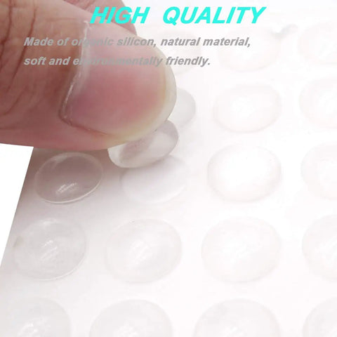 Close-up of hand peeling silicone pad from 202 Pieces Clear Adhesive Bumper Pads Set in Five Shapes with Self Adhesive Transparent Rubber Feet