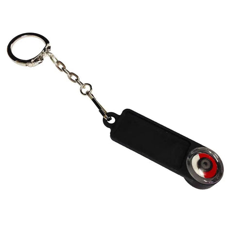 Rotation Tester And AC Detector For Circulating Pumps And Solenoid Valves keyring device with black body and red detail.
