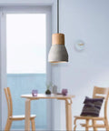 Cool Concrete Pendant Light For Dining Room And Kitchen Bar Nordic Industrial Hanging Light Fixture in gray above dining table.