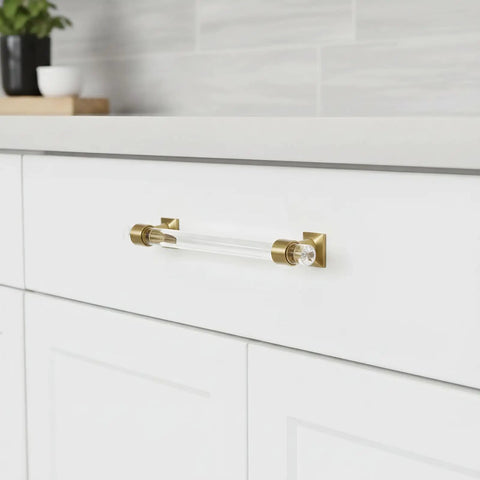 10 Pack Clear Acrylic Cabinet Pulls With Antique Brass Hardware 5 Inch Round Tube Drawer Handles installed on white cabinet