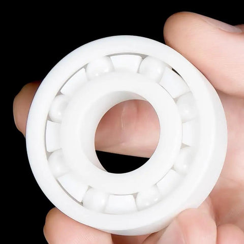Top Tier Zirconia Full Ceramic Ball Bearings Run Ultra Fast And Stay Cool Under Load heavy duty single ceramic bearing in hand.