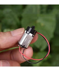 Top Rate N20 Micro Planetary Gearbox With 6 VOLT Direct Current Power Delivering A Slick 12mm Cross Shaft Cruising Chill At 117Rpm held in hand.