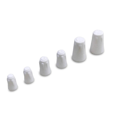 Six white ceramic wire caps arranged diagonally in ascending sizes (side view)
