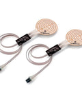 Therm-IC heating elements, pair of beige circular pads with copper spiral pattern and dual cords.