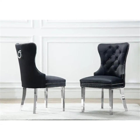 Two black velvet chairs with tufted backs and metal legs from the Six Piece Round Dining Set With Marble Top And Lazy Susan Modern Black Dining Room Set Includes Six Chairs For Easy Grub Gathering Minimal Assembly Required Stylish Home Decor Game Changer.