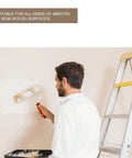 User painting a wall with a Hassle Free Mini Wall Paint Roller With Dense Wool Cover For Seamless Door And Baseboard Trim Projects Quick Setup Do It Yourself House Painting Supplies Delivers A Flawless Finish Every Single Time.