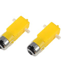 Two yellow TT gear motors for the Hands On STEM Motor Kit With Plastic Gears And Mini DC Motors 1.5 to 3V 9000 to 25000 RPM.