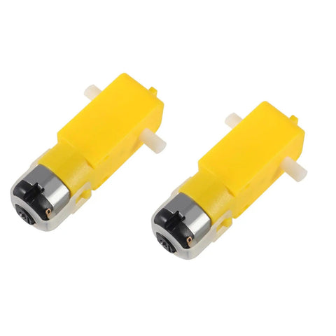 Two yellow TT gear motors for the Hands On STEM Motor Kit With Plastic Gears And Mini DC Motors 1.5 to 3V 9000 to 25000 RPM.